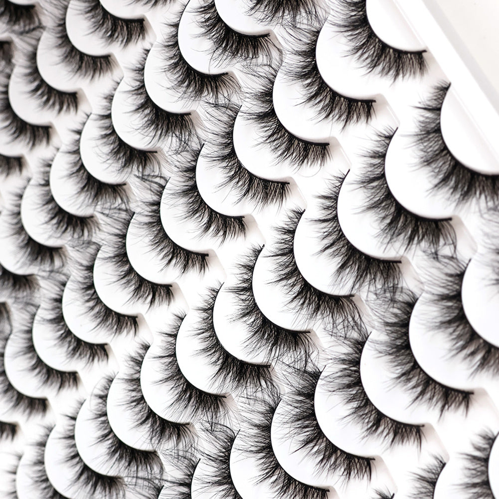 Rows of 3D false eyelashes in white trays, showcasing multi-layered, realistic, soft, comfortable lashes.